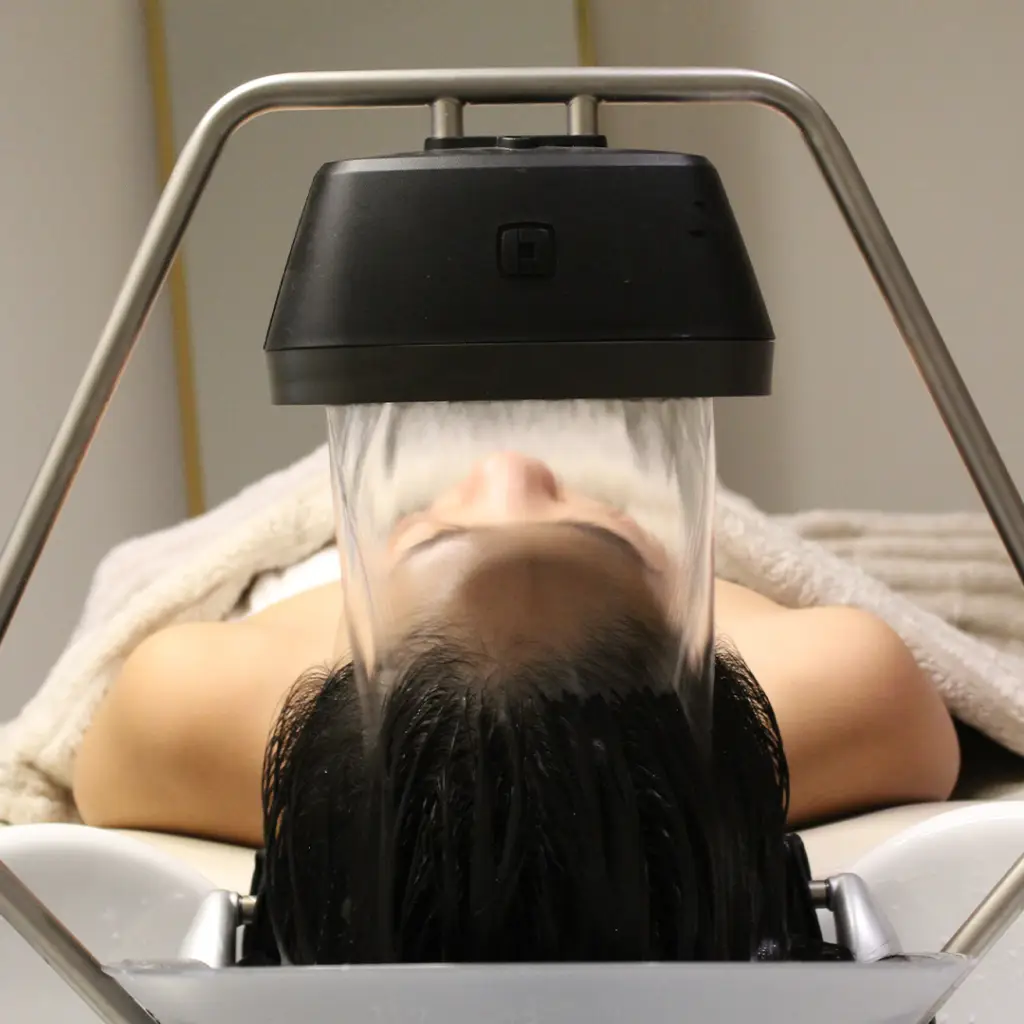 Woman receiving YUME head spa